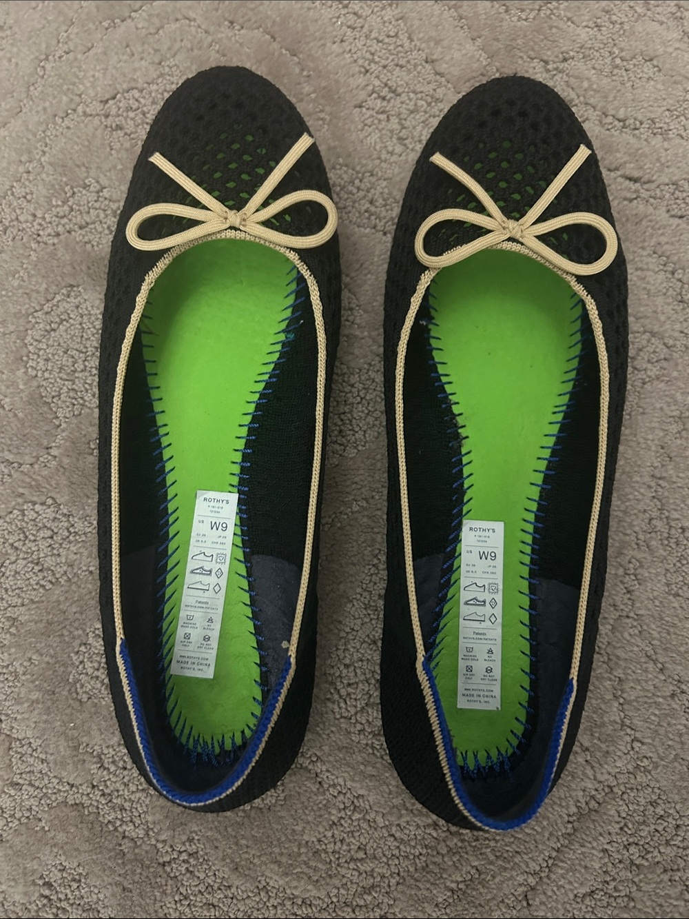 Rothy's Black Knit Ballet Flats with Cream Trim and Blue Heel Accent